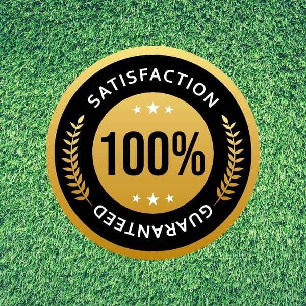 A gold and black badge reading "100% Satisfaction Guaranteed" displayed over a background of lush green grass.