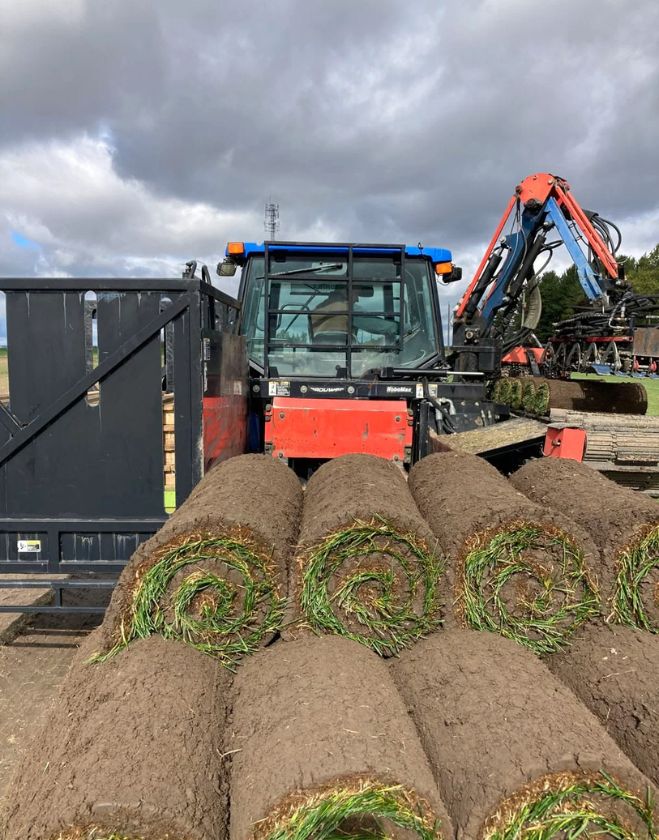 Gallery 27 Perfectly rolled cylinders of fresh soil and green grass stacked on the back of a harvester tractor, destined for properties in Downtown Grimsby.