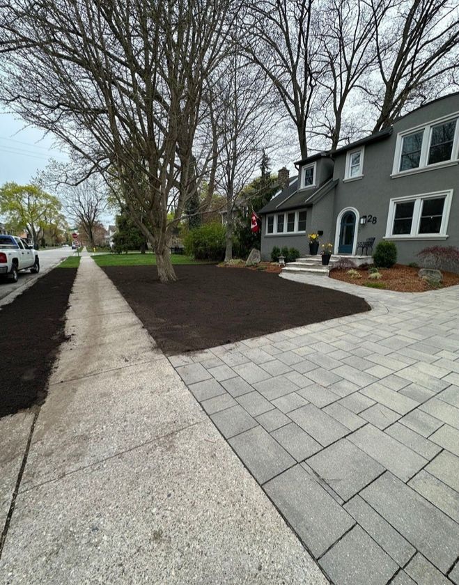 Gallery 16 A perfectly smooth and fully graded dirt front yard ready for fresh sod installation at a residential property in the North End of Hamilton.