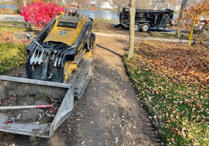 Services 3 Landscaping equipment being used for grading and soil preparation before a sod installation in Hamilton.
